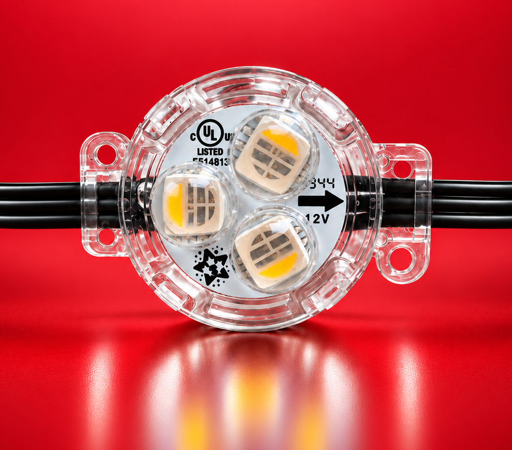 Close-up of a three-LED lighting module against a red background